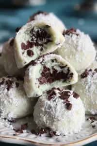 Delicious Mint Chocolate Chip Snowball Cookies on a decorative plate.