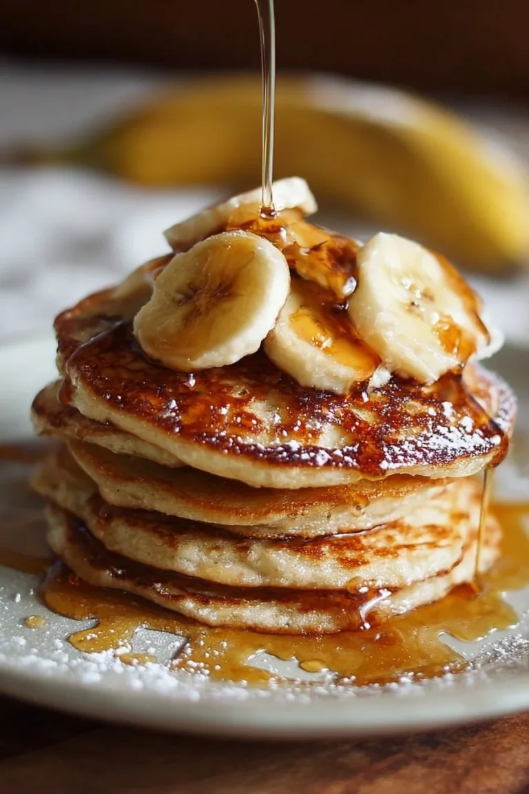 Delicious brown sugar banana pancakes stacked with syrup