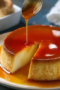Delicious creamy caramel flan dessert served in a clear glass dish