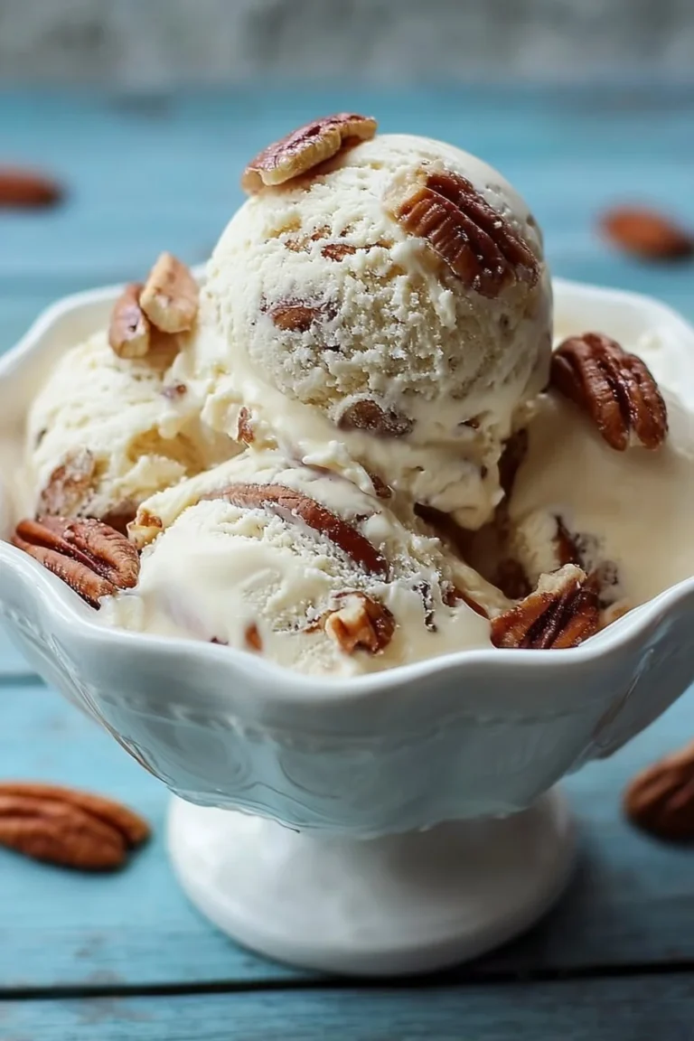 Delicious homemade butter pecan ice cream served in a bowl with pecan pieces.